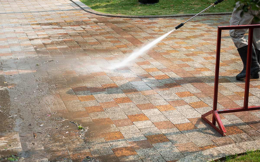 Pressure washing a stone patio on Cape Cod